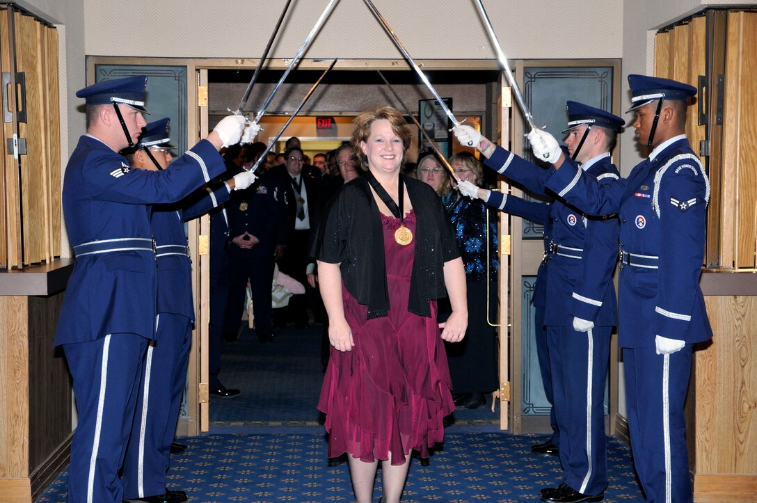 AFOTEC Civilian Category II nominee/winner Gail Broxson enters the awards banquet ballroom through the honorary saber arch.