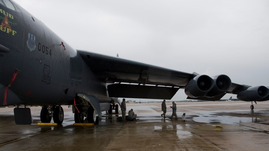 Airmen from the 2nd Aircraft Maintenance Squadron work on a B-52H Stratofortress on Barksdale Air Force Base, La., March 21. Airmen of the 2 AMXS are out on the flightline everyday performing the 2nd Bomb Wing mission. It doesn't matter if it's hot, cold, raining or snowing; Airmen are out there to ensure the B-52 stays mission ready at all times. (U.S. Air Force photo/Airman 1st Class Benjamin Gonsier)(RELEASED)
