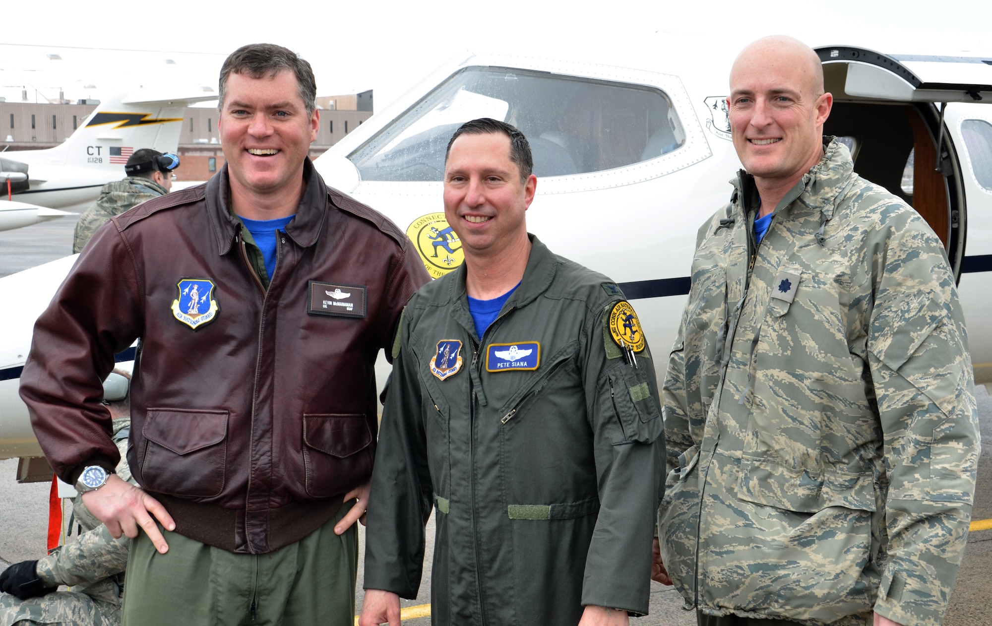 Col. Pete “Meat” Siana stands with two of his longtime friends who flew with him during his “fini-flight” March 3, 2012, at Bradley Air National Guard Base, East Granby, Conn.  Col. Kevin “Sloth” McManaman (left) and Lt. Col. Kenneth “Tuna” LaTona have known Siana for the better part of his military career. (U.S. Air Force photo by Tech. Sgt. Joshua Mead)
