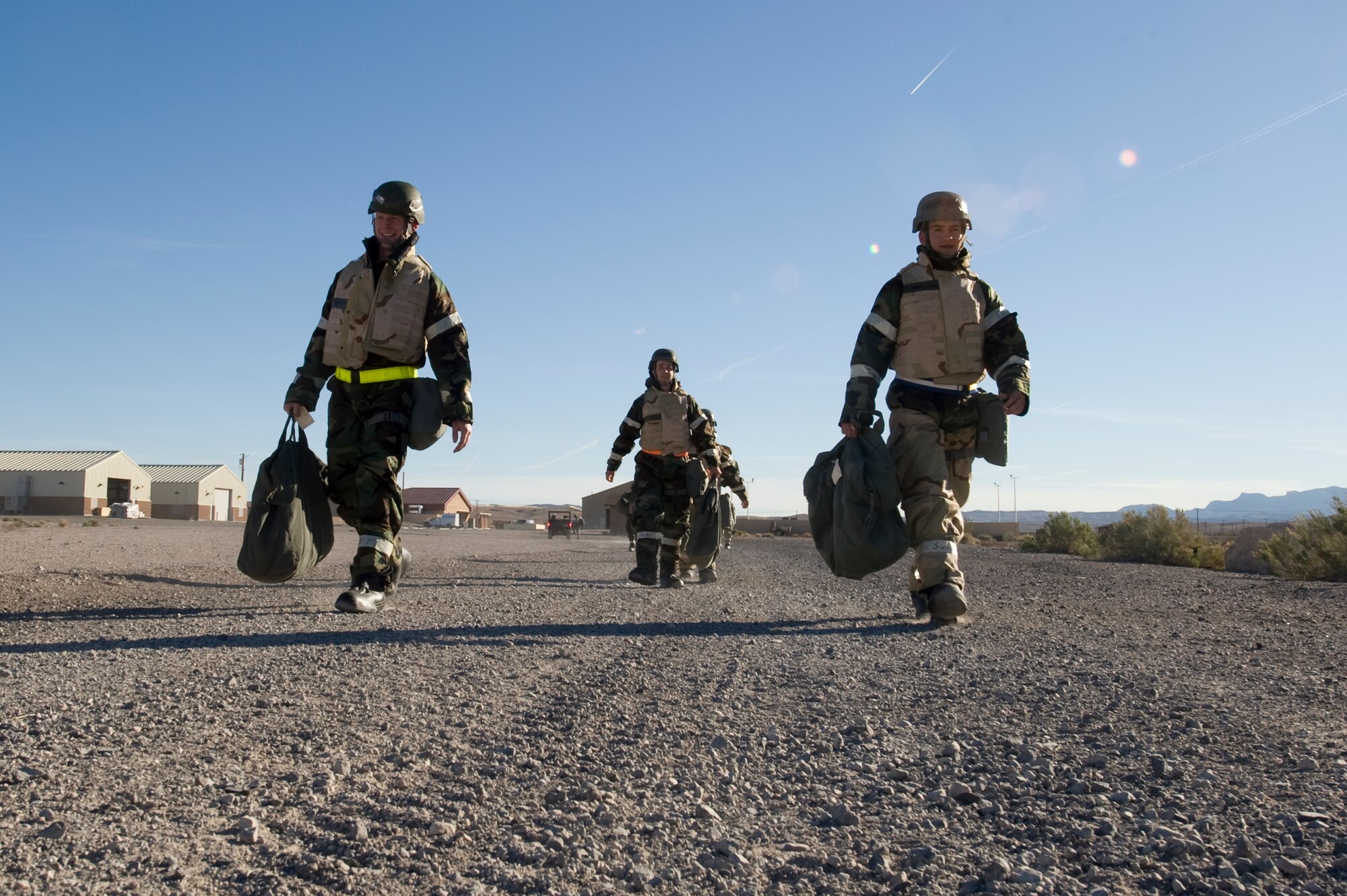 U.S Air Force Airmen make their way toward Camp C.O.B.R.A.during an Operational Readiness Exercise March 21, 2012, at Nellis Air Force Base, Nev. The Airmen's combat skills and ability to operate in a deployed environment were tested during the exercise. (U.S. Air Force photo by Airman 1st Class Matthew Lancaster)