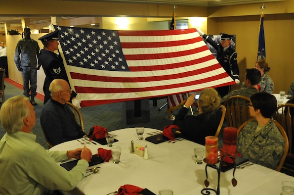 Members of the Davis Monthan Air Force Base Honor Guard perform a flag folding ceremony for Mr. Ralph Stewart during a ceremony honoring his service in the U.S. Army Air Corps. Mr. Stewart served as a mechanic on the B-25 and B-26 bombers during World War II as a Tuskegee Airman. (U.S. Air Force Photo/Master Sgt. Luke Johnson)
