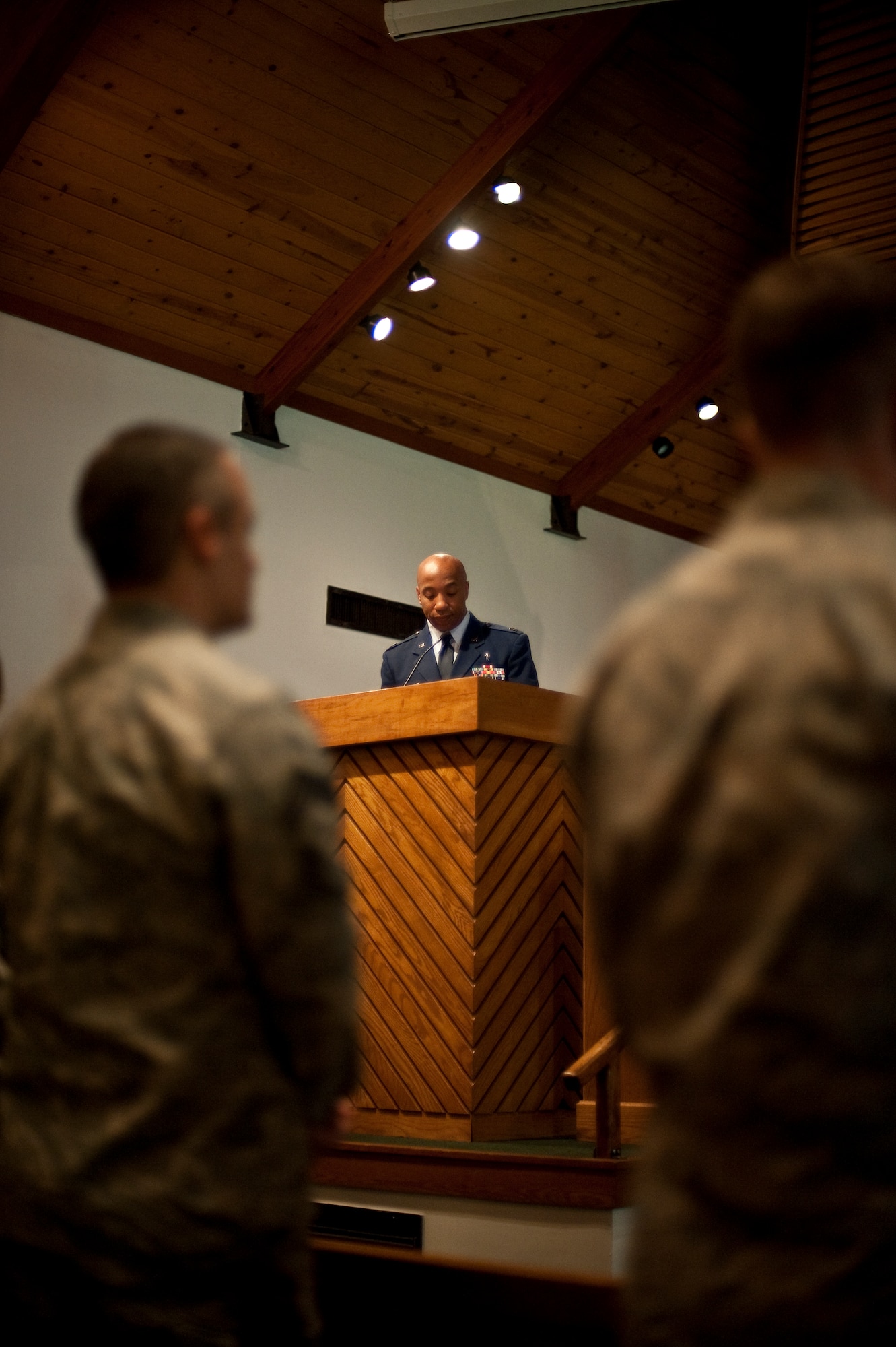 Capt. Ronnelle Armstrong, a chaplain from the 1st Special Operations Wing, provides the invocation during a memorial service at the base chapel at Hurlburt Field, Fla., March 16, 2012. The service honored the life and legacy of Rony, a deceased military working dog from the 1st Special Operations Security Forces Squadron. (U.S. Air Force photo/Airman 1st Class Christopher Williams)(Released)