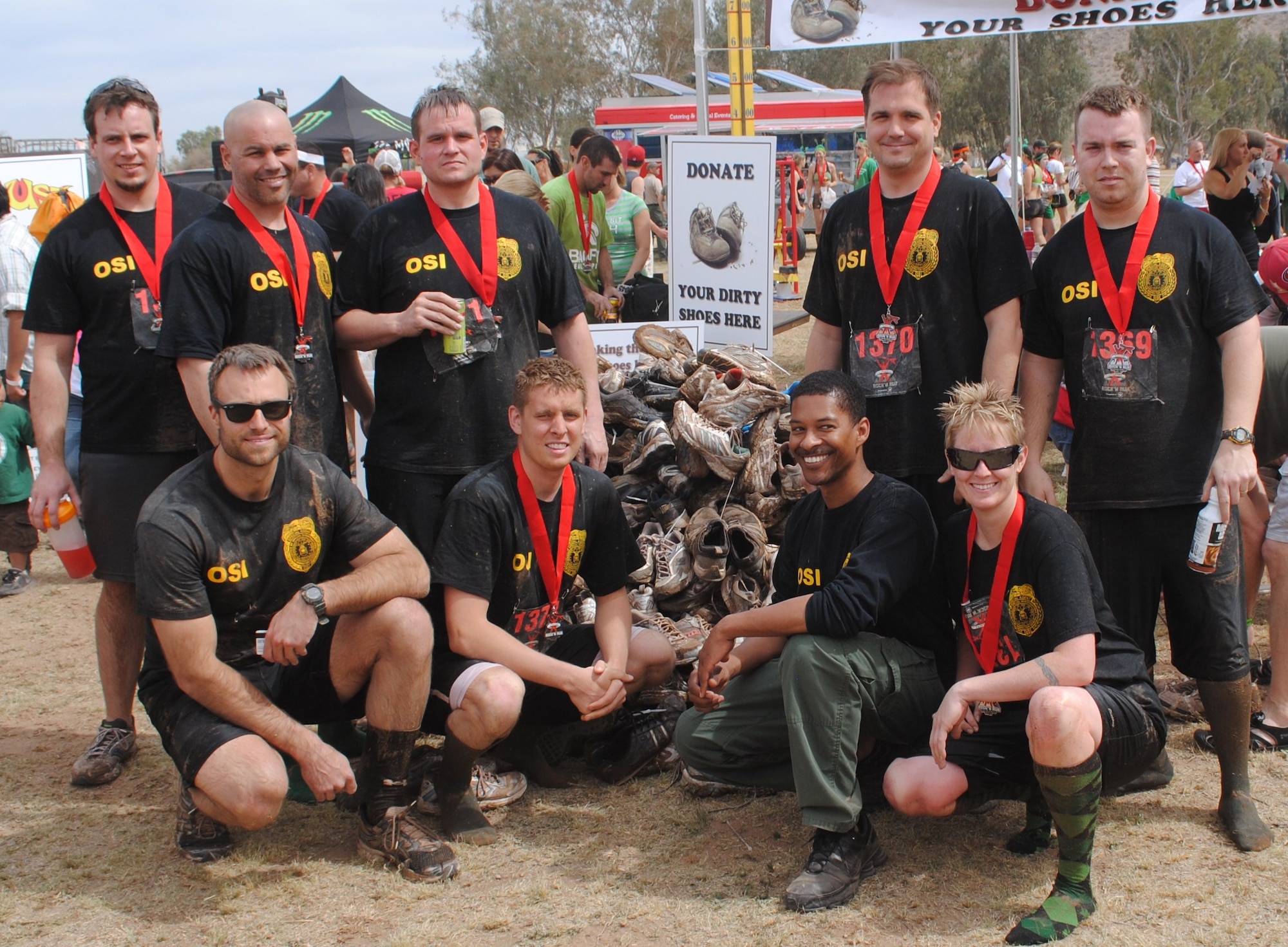 OSI special agents from Detachment 421, Luke AFB, Ariz.,celebrated St. Patrick's Day by getting involved in an especially challenging fitness event March 17. A team from OSI participated in a Gladiator Rock-n-Run Mini Mudder event to support Talk About Curing Autism. The event combined a 5K off-road race across mountainous and desert terrain with a series of 17 extreme obstacles.  Every OSI team member crossed the finish line, generally much less clean than they began it. (U.S. Air Force photo provided by Det. 421.)
