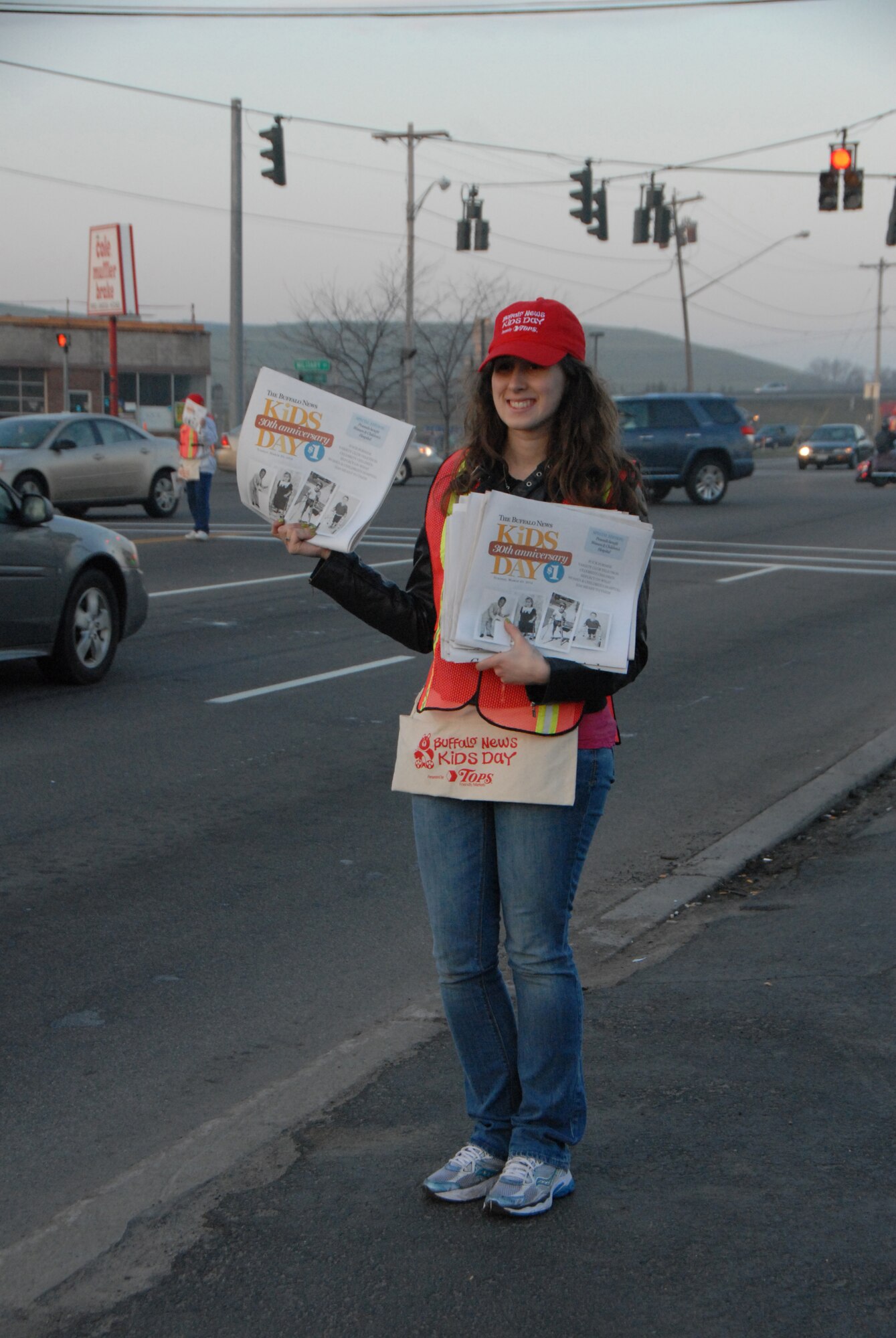 Staff Sgt. Sharon Gouchie of the 107th Airlift Wing, Niagara Falls NY volunteered to sell Buffalo News Kids Day papers. The proceeds benefit Women & Children's Hospital.(Air Force Photo/ Tech Sgt. Catherine Perretta)