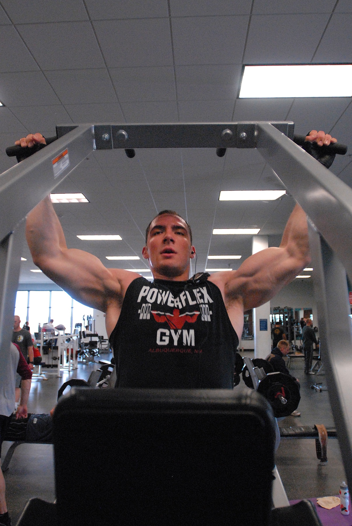 GOODFELLOW AIR FORCE BASE, Texas - Airman 1st Class Duayne Martinez, 17th Contracting Squadron does a set of pull ups at the Mathis Gym, Feb. 9. Martinez works out twice a day in the gym and runs 1.5 – 3miles three times a week. (U.S. Air Force photo/ Airman 1st Class Michael Smith)