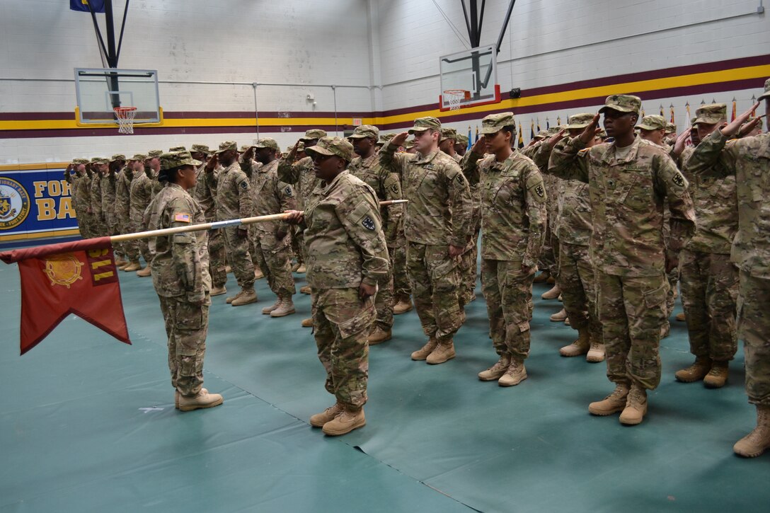 Soldiers of 119th Inland Cargo Transfer Company, 11th Transportation Battalion, 7th Sustainment Brigade, led by Capt. Felicia Sturgeon, salute the American flag one last time on domestic soil before deploying to Afghanistan in support of Operation Enduring Freedom. The deployment ceremony, which was held at the Joint Expeditionary Base-Fort Story Gym, was held to honor those who are deploying and gave the Soldiers one last chance to tell family, friends and fellow comrades goodbye. (U.S. Army photo by 1st Lt. Andrea Whitaker/Released)