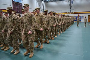 Approximately 160 Soldiers of 119th Inland Cargo Transfer Company, 11th Transportation Battalion, 7th Sustainment Brigade, proudly march into the Joint Expeditionary Base-Fort Story Gym to bid family and friends goodbye during their deployment ceremony Tuesday.  The 119th ICTC, lead by Capt. Felicia Sturgeon, deployed to Afghanistan for 12 months in support of Operation Enduring Freedom. (U.S. Army photo by 1st Lt. Andrea Whitaker/Released)