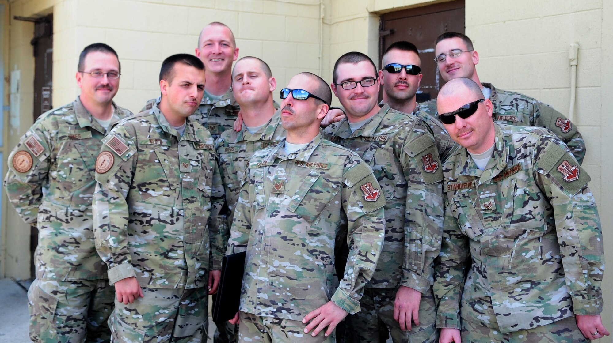 Airmen from the 9th Munitions Squadron, Beale AFB, Calif., proudly display the progress of their mustaches. The entire squadron was challenged to a competition by their commander in observance of Mustache March, which is famed across the Department of Defense. (U.S. Air Force photo by Senior Airman Shawn Nickel/Released)