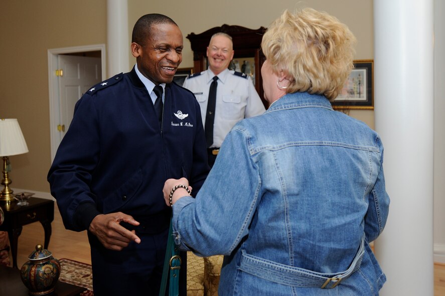 Air Force District of Washington Commander Maj. Gen. Darren W. McDew greets Janet Grampp, Joint Base Andrews’ Fisher House manager, March 15 on JBA, Md. The Fisher House program is a unique private-public partnership that supports America's military through a program that enables family members to be close to a loved one during hospitalization or treatment for illness, disease or injury. According to the JBA Fisher House manager, the Fisher House could not be successful without the numerous dedicated volunteers who spend countless hours at the home cooking, cleaning, and caring for families. (U.S. Air Force photo by Staff Sgt. Christopher Ruano) 
