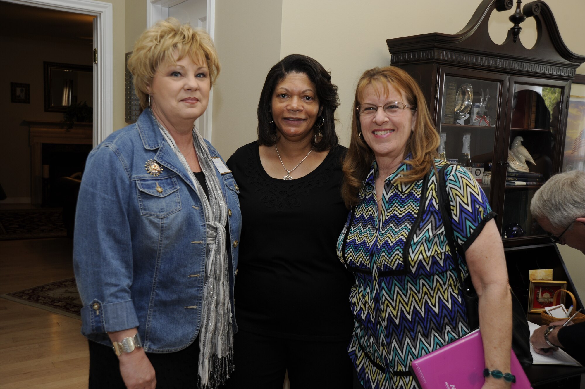 From left to right, Janet Grampp, Joint Base Andrews’ Fisher House manager, Evelyn McDew, wife of Air Force District of Washington Commander Maj. Gen. Darren W. McDew and Susan Neal, Fisher House volunteer greet each other March 15 on JBA, Md. Annually, the Fisher House program serves more than 12,000 families, and have made available over three million days of lodging to family members since the program originated in 1990. (U.S. Air Force photo by Staff Sgt. Christopher Ruano)