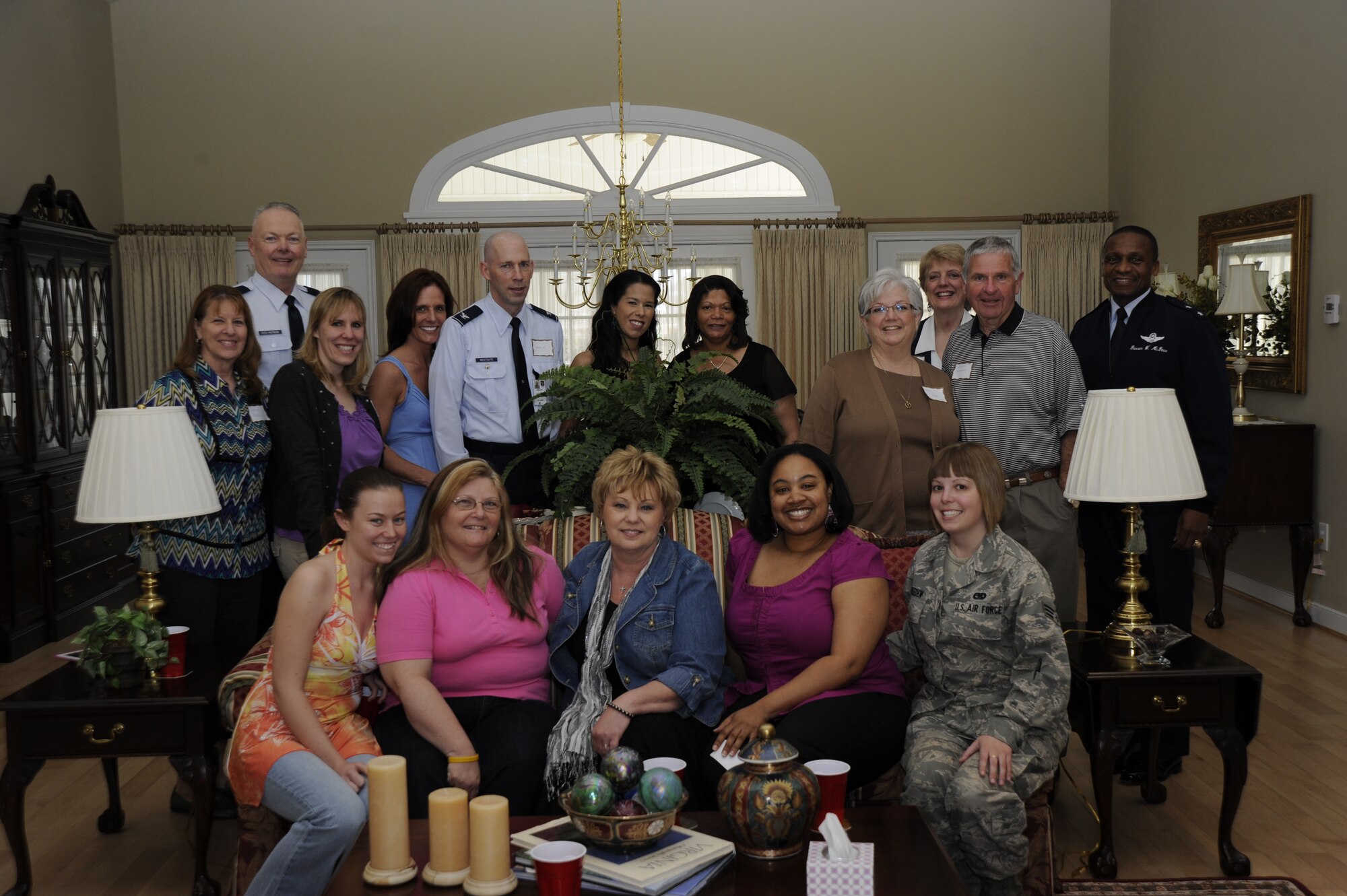 Fisher house volunteers gather around Janet Grampp, Joint Base Andrews’ Fisher House manager to capture the moment Mar. 15 on JBA, Md. The luncheon was provided by the McDew family in thanks for the Fisher Houses service to our service members. (U.S. Air Force by Tech. Sgt. Chyenne Adams)