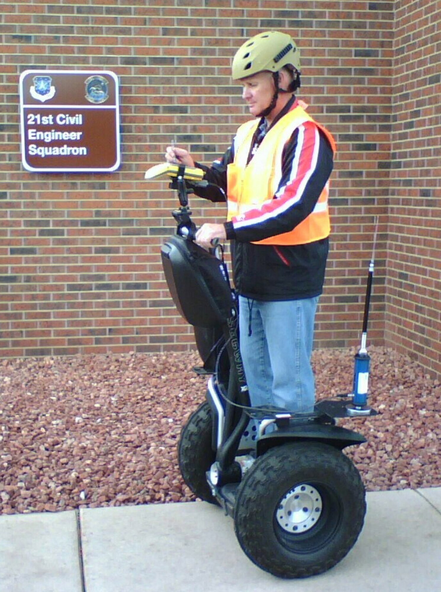 Roger Clarke, 21st Civil Engineer Squadron, uses a Segway personal transporter and a GPS unit to map features of the base. Using the two together allows the 21st CES to gather data more quickly. (U.S. Air Force photo)