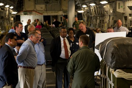 Staff Sgt. Joe Berglund answers questions about the capabilities of the C-17 Globemaster III during a brief for newly inducted Honorary Commanders at Joint Base Charleston - Air Base March 14. More than 35 local area business and community leaders became Honorary Commanders of various Air Force, Navy and Army units at JB Charleston. Berglund is loadmaster in the 17th Airlift Squadron, 437th Airlift Wing. (U.S. Air Force photo by Airman 1st Class George Goslin)