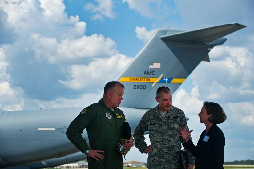 Col. Erik Hansen and Chief Master Sgt. Larry Williams brief Jennifer Bozard, a newly inducted Honorary Commander, on the capabilities of the C-17 Globemaster III at Joint Base Charleston – Air Base March 14. More than 35 local area business and community leaders became Honorary Commanders of various Air Force, Navy and Army organizations at JB Charleston. Hansen is the 437th Airlift Wing commander, Williams is the 437th AW command chief and Bozard is the Kiawah Island Golf Resort director of human resources. (U.S. Air Force photo by Airman 1st Class George Goslin)