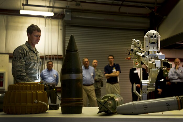 Airman 1st Class Robert Hardy demonstrates the capabilities of the Air Force Medium-Sized Robot for newly inducted Honorary Commanders at JB Charleston - Air Base March 14. More than 30 local area business and community leaders became Honorary Commanders of various Air Force, Navy and Army organizations at JB Charleston. Hardy is a 628th Civil Engineer Squadron explosive ordinance disposal apprentice. (U.S. Air Force photo by Airman 1st Class George Goslin)