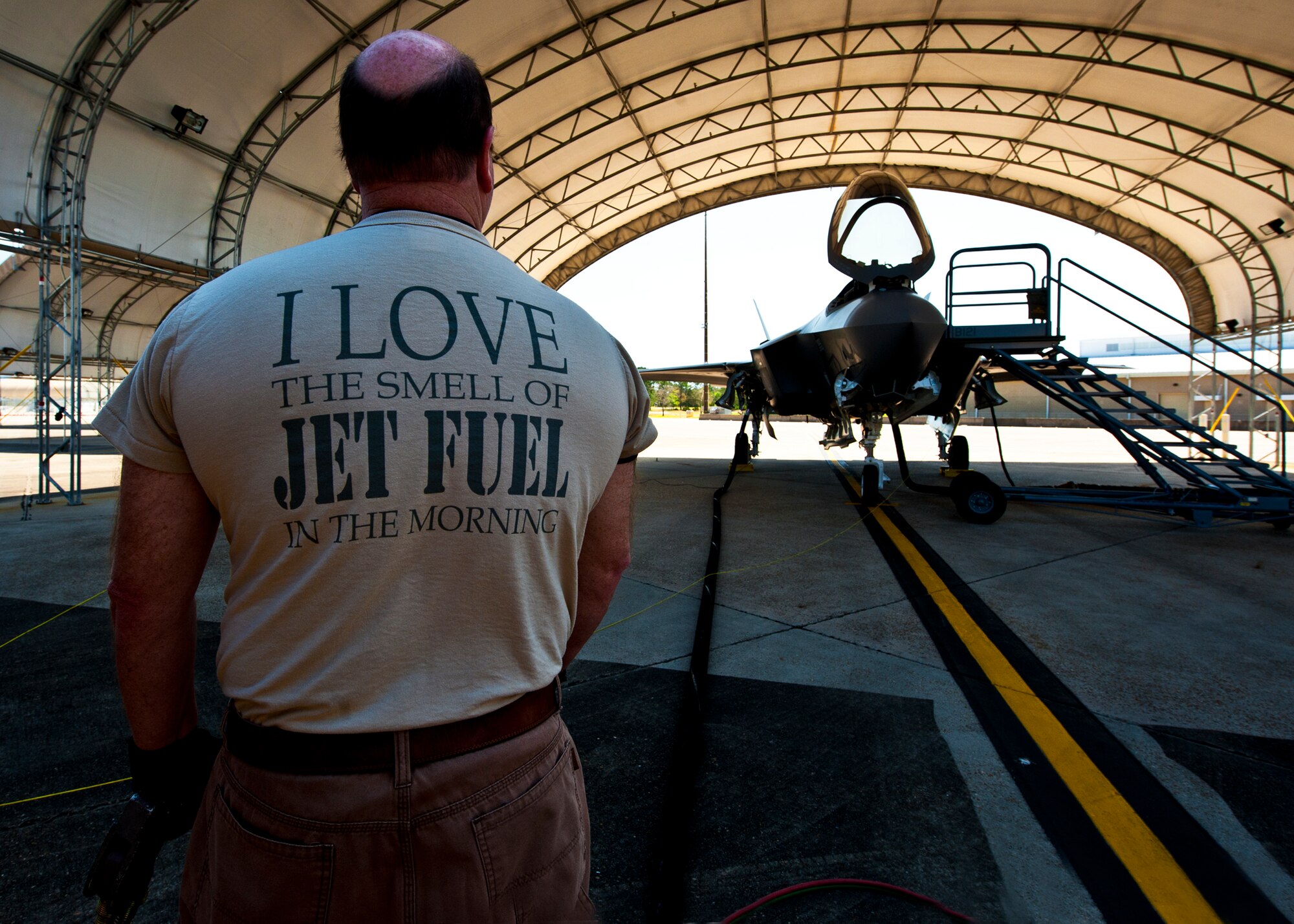 James Murr, a seven-year member of the 96th Petroleum Oil and Lubricants flight, refuels the F-35A Lightning II joint strike fighter’s 18,000 pound internal fuel tanks after its sortie at Eglin Air Force Base, Fla., March 20.  POL is responsible for delivering fuel to all aircraft on base.  (U.S. Air Force photo/Samuel King Jr.)