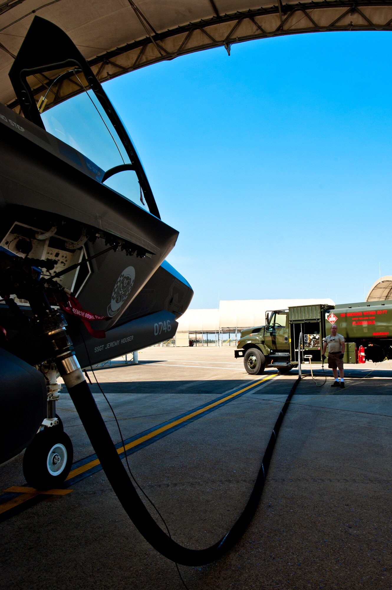 James Murr, a seven-year member of the 96th Petroleum Oil and Lubricants flight, refuels the F-35A Lightning II joint strike fighter’s 18,000 pound internal fuel tanks after its sortie at Eglin Air Force Base, Fla., March 20.  POL is responsible for delivering fuel to all aircraft on base.  (U.S. Air Force photo/Samuel King Jr.)