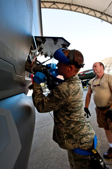 Staff Sgt. Jason Anderson, of the 33rd Aircraft Maintenance Squadron, connects the fuel hose to the F-35A Lightning II joint strike fighter to refuel the aircraft after its sortie at Eglin Air Force Base, Fla., March 20.  The 33rd Fighter Wing receives fuel for their aircraft from the 96th Petroleum Oil and Lubricants flight, part of the 96th Air Base Wing.  POL is responsible for delivering fuel to all aircraft on base.  (U.S. Air Force photo/Samuel King Jr.)