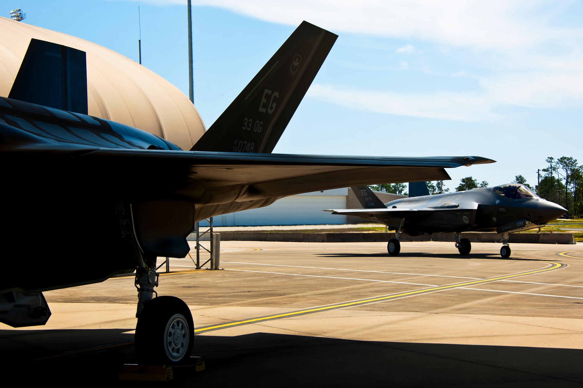 An F-35A Lightning II joint strike fighter taxis back after another successful sortie at Eglin Air Force Base, Fla., March 20.  This was the fourth sortie flown since the aircraft was cleared to fly Feb. 28.  (U.S. Air Force photo/Samuel King Jr.)