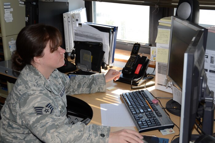 Staff Sgt. Donna Zsarnay, 628th Logistics Readiness Squadron Vehicle Operations dispatcher, coordinates between drivers and the Vehicle Operations control center March 14 at Joint Base Charleston – Air Base. Dispatchers communicate with operators or drivers and direct them where to go. They also handle issuing government vehicles. (U.S. Air Force photo by Senior Airman Anthony J. Hyatt)