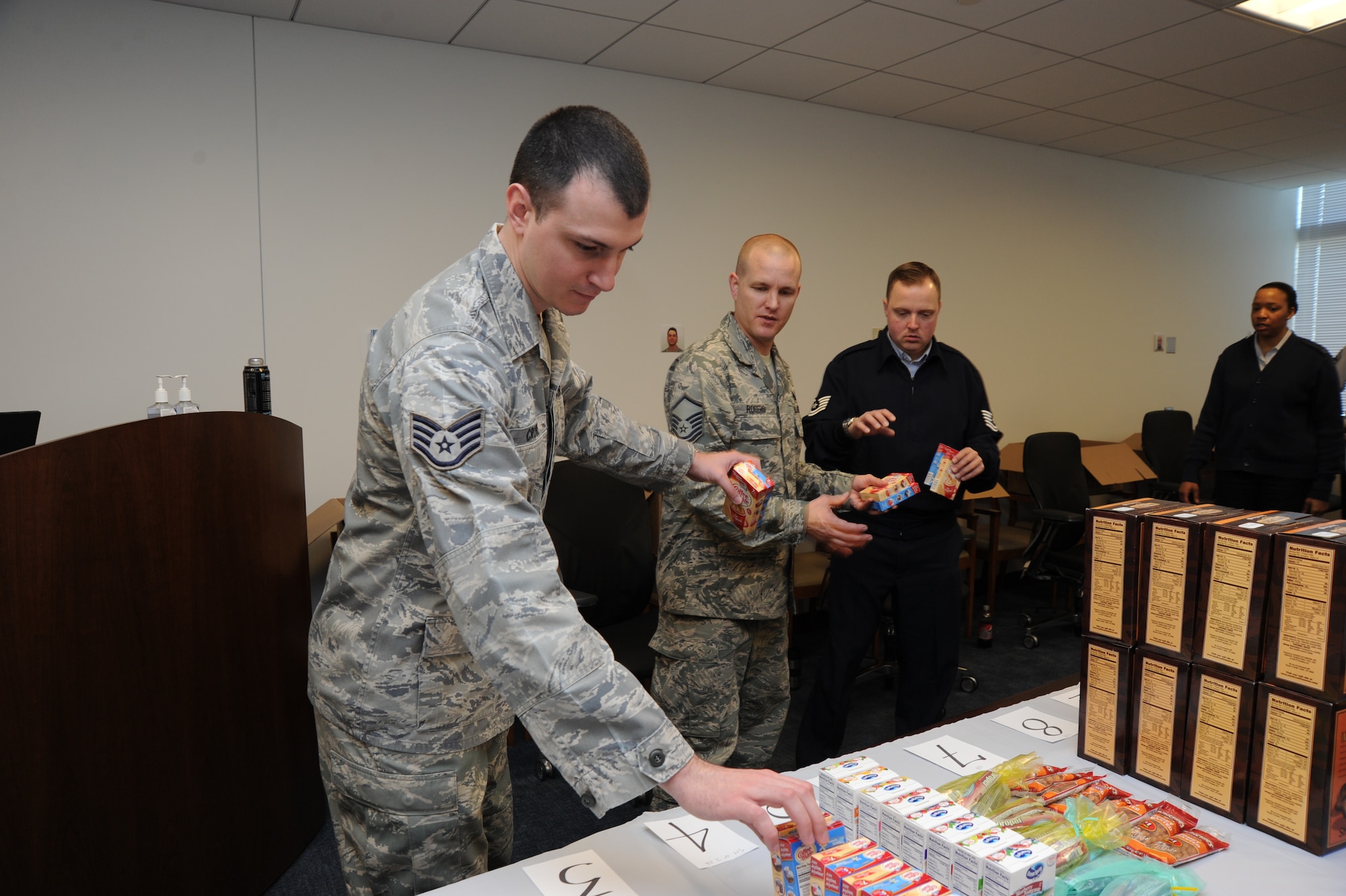 Air Force District of Washington contracting specialist, Staff Sgt. Sean Crowe, passes down Easter treats for care packages March 1 on Joint Base Andrews, Md. While deployed last year Crowe recalls receiving his package “The care package from my AFDW family could not have come at a better time. The base I was deploying to was drawing down and many of the facilities, including the base exchange, were limiting their supplies or closing. Toiletries, snacks, and other items were hard to come by,” he said. (U.S. Air Force photo by Staff Sgt. Christopher Ruano) 