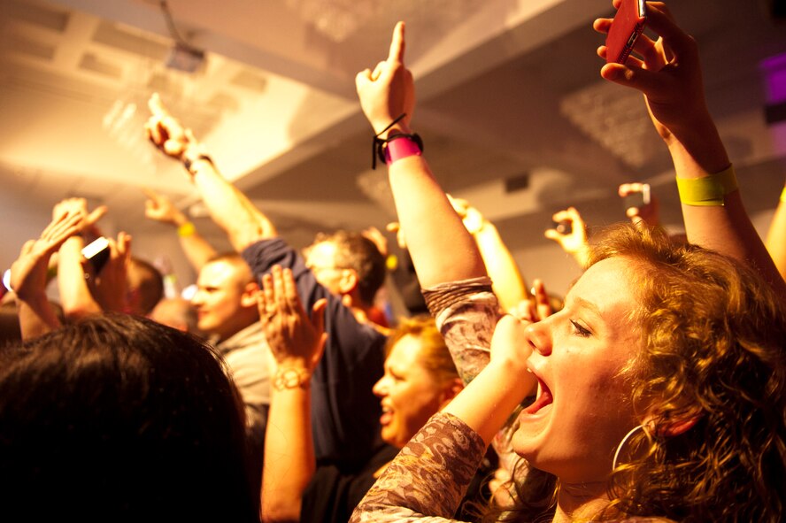 Team Incirlik members cheer for the band Seether during a performance March 19, 2012, at the Club Complex at Incirlik Air Base, Turkey. The hard-rock band visited Incirlik as part of a USO tour through Italy and Turkey. (U.S. Air Force photo by Tech. Sgt. Michael B. Keller/Released)