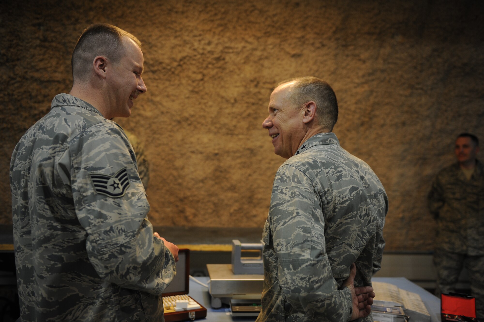 SOUTHWEST ASIA – Staff Sgt. Ryan Bush, 379th Expeditionary Maintenance Squadron precision measurement equipment laboratory technician, explains various ways to calibrate equipment to Gen. Donald Hoffman, Air Force Material Command commander, during Hoffman’s visit to the base March 16. (U.S. Air Force photo/Staff Sgt. Nathanael Callon)