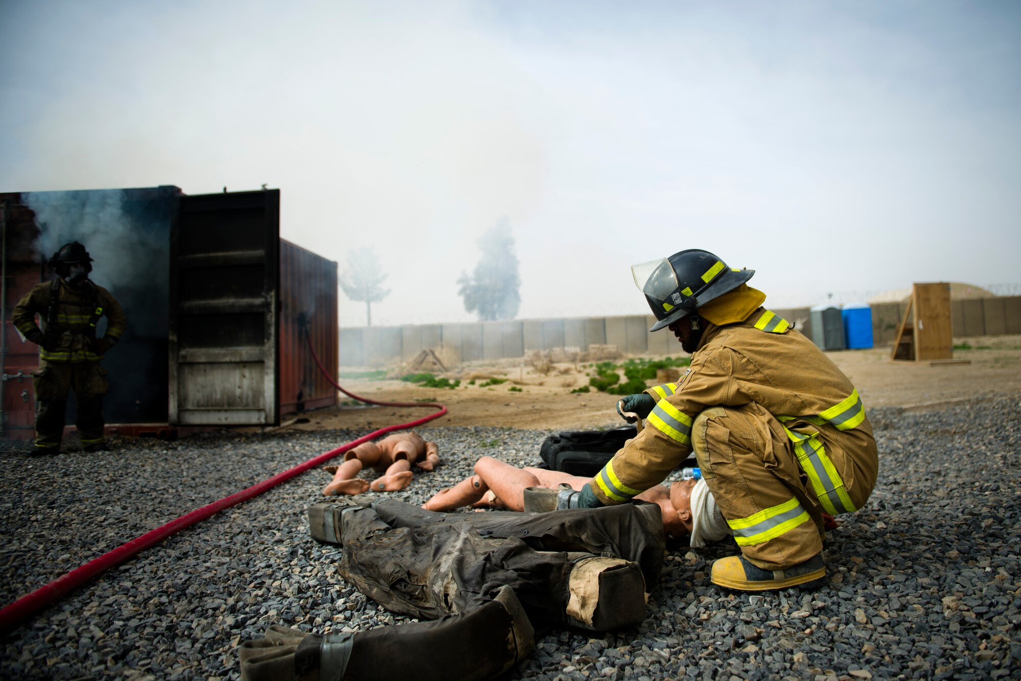 Afghan Airmen from the Air Expeditionary Advisory Training Mission - Afghanistan, conduct fire training March 15, 2012 at Kandahar Airfield, Afghanistan. Chief Master Sgt. Robert Sealey, U.S. Air Forces Central command chief, observed training while visiting the base.  (U.S. Air Force photo by Staff Sgt. David Salanitri) 