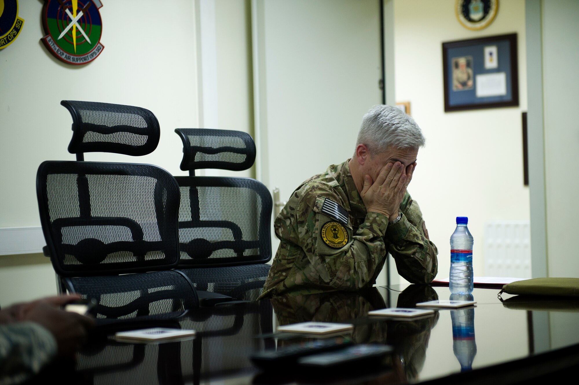Chief Master Sgt. Robert Sealey, U.S. Air Forces Central command chief, fights off exhaustion during a trip to Kabul International Airport, Afghanistan, March 13, 2012. During his trip to Afghanistan, Sealey visited numerous locations often traveling hundreds of miles a day, flying from base to base. As command chief, Sealey seldom has "off time." (U.S. Air Force photo by Staff Sgt. David Salanitri) 

