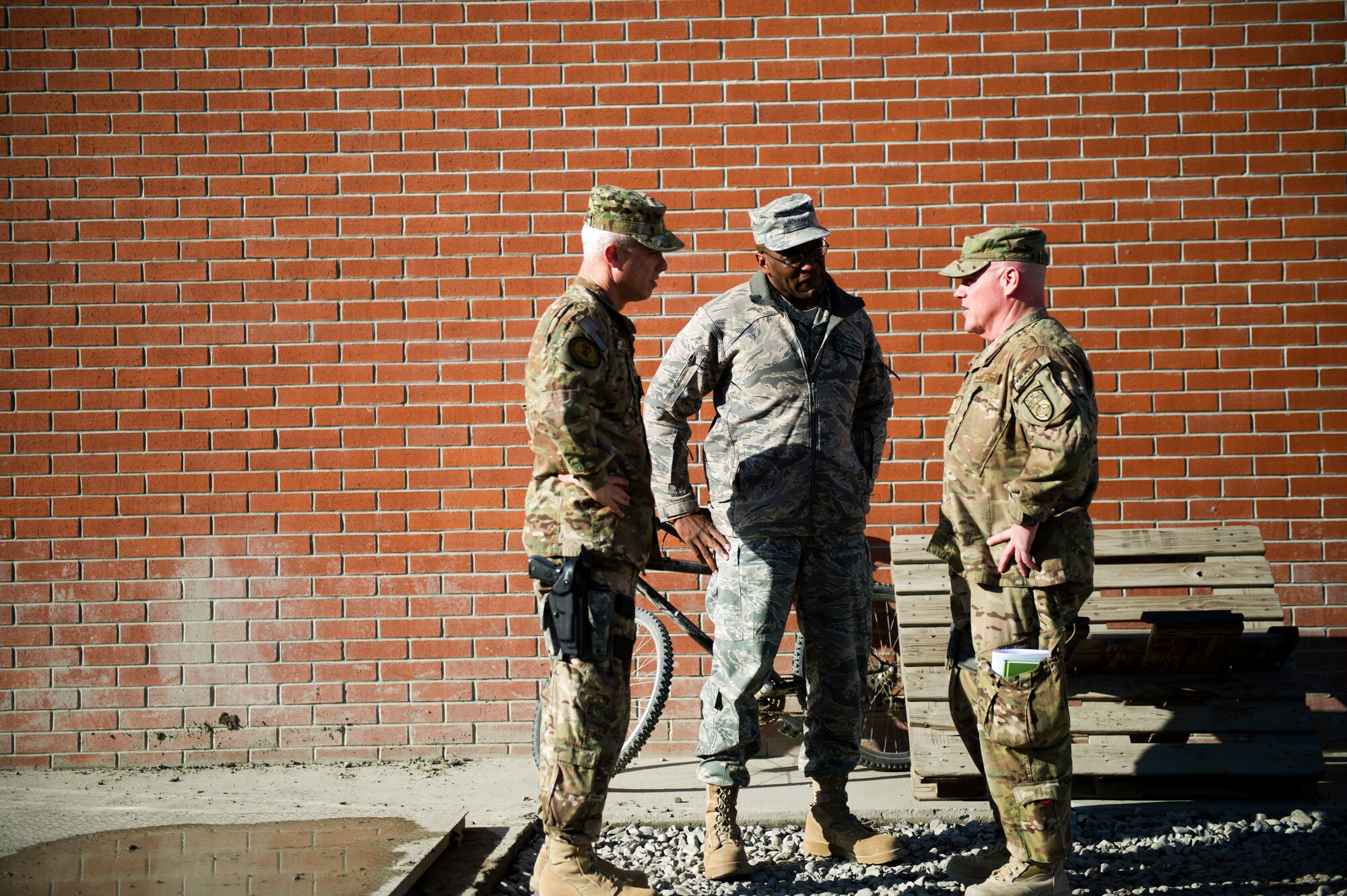 From left, Chief Master Sgt. Robert Sealey, U.S. Air Forces Central command chief, talks with Chief Master Sgt. Al Herring, 9th Air and Space Expeditionary Task Force - Afghanistan command chief, and Chief Master Sgt. John Hoffman, 438th Air Expeditionary Wing command chief, at Kabul International Airport, March 12, 2012. (U.S. Air Force photo by Staff Sgt. David Salanitri) 
