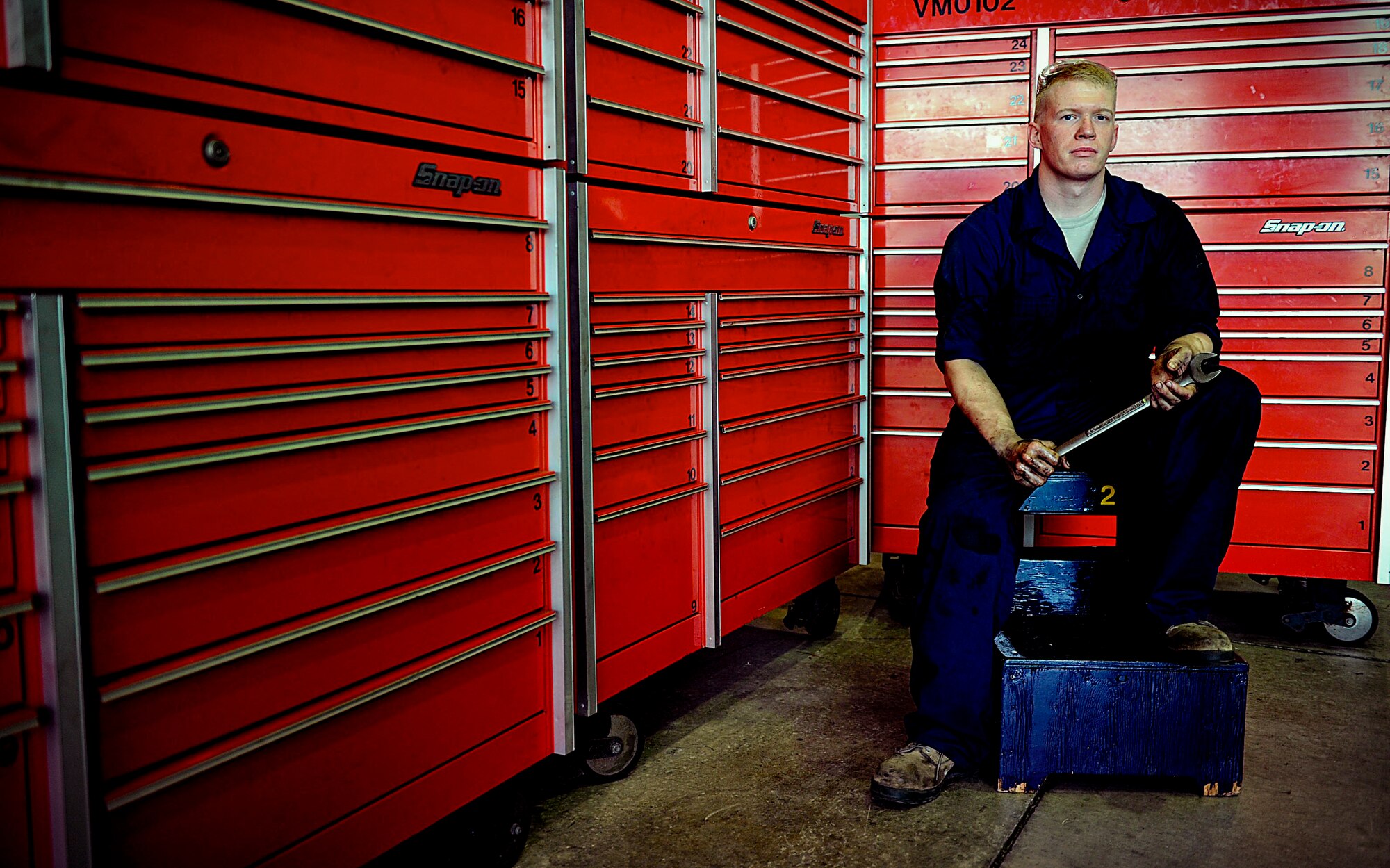 U.S. Air Force Senior Airman Craig Galvin, 18th Logistics Readiness Squadron vehicle maintenance journeyman, takes a break from fixing a flex plate on Kadena Air Base, Japan, March 21, 2012. Although Galvin has only been a mechanic in the Air Force for two years, he has been working on vehicles since he was 16 years old. (U.S. Air Force photo by Airman 1st Class Brooke P. Beers/Released)