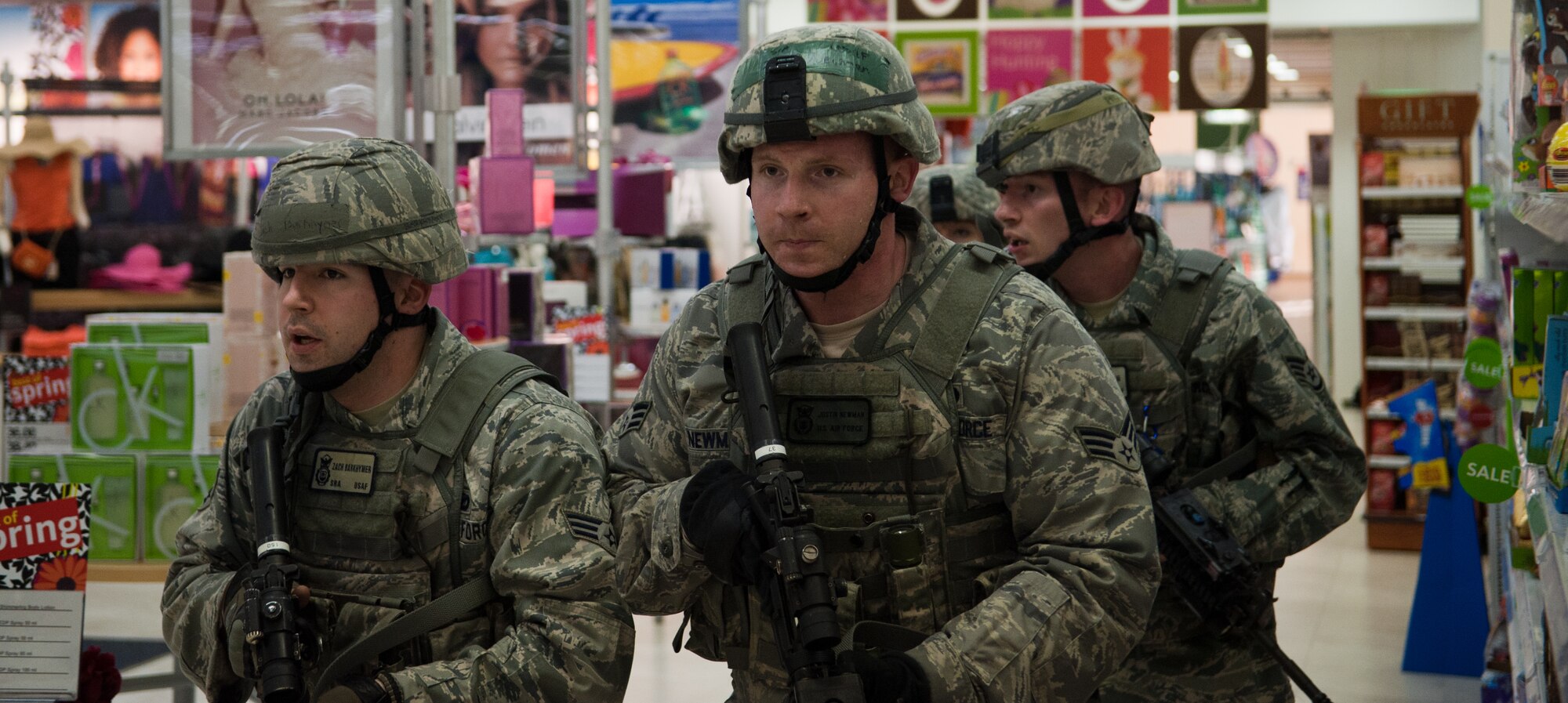 YOKOTA AIR BASE, Japan -- A team of patrolmen from the 374th Security Forces Squadron proceed down an aisle during an active shooter scenario at Yokota Air Base, Japan, March 16, 2012. Teams swept the area to find a role player pretending to be the active shooter and control the situation. (U.S. Air Force photo/Airman 1st Class John D. Partlow)