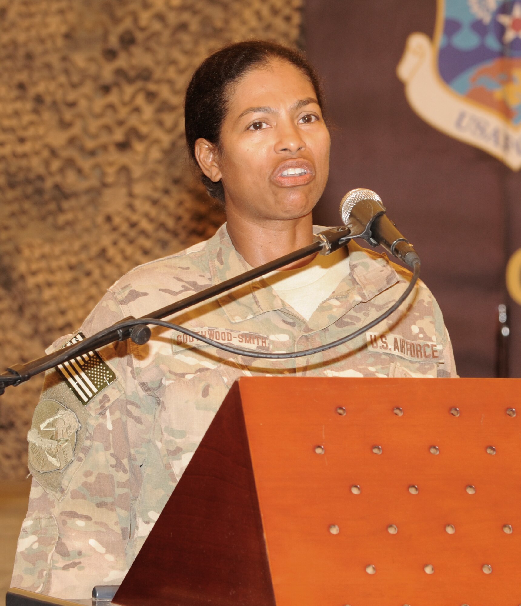 SOUTHWEST ASIA - Tech. Sgt. Donna Southwood-Smith sings the national anthem at the 2012 National Prayer Luncheon at the Phantom Center March 20, 2012. Chaplain (Col.) Dondi E. Costin, Air Forces Central command chaplain, was the guest speaker at the event. Southwood-Smith is deployed from Seymour Johnson Air Force Base, N.C.  (U.S. Air Force photo/Tech. Sgt. Arian Nead)  
 
