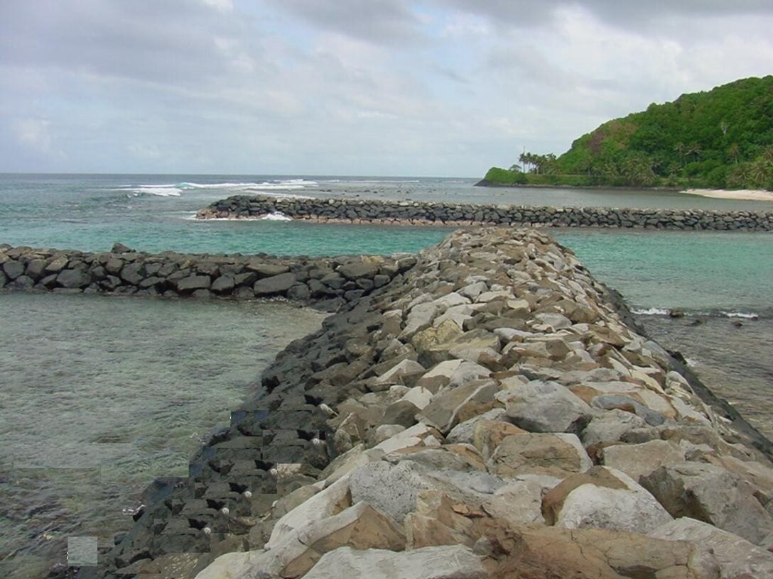 View of harbor protective structures. Auasi is the third small boat harbor completed by the Corps to improve the territory's inter-island transportation system.