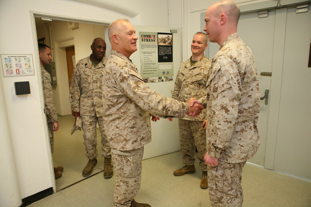 Lieutenant General Dennis J. Hejlik, commanding general, U.S. Marine Corps Forces, Europe, greets MGySgt. Darby Carter, G-1 chief, U.S. Marine Corps Forces, Europe, during his recent visit to U.S. Marine Corps Forces, Europe headquarters aboard USAG Stuttgart. Hejlik is in the process of visiting multiple locations in the U.S. European Command area of operation to talk to Marines and observe training his Marines are conducting.