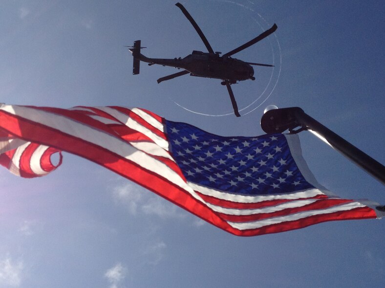 U.S. Aircrew Airmen hover in an HH-60G Pave Hawk helicopter overhead while U.S. pararescue Airmen from the 920th Rescue Wing, Patrick Air Force Base, Fla., compete in a maritime personal recovery exercise with Canadian Search and Rescue Technicians during an annual competition in Key West, Fla. Both countries exercise together annually to synergize their rescue techniques. (U.S. Air Force photo by/Tech. Sgt. Michael Fuller)