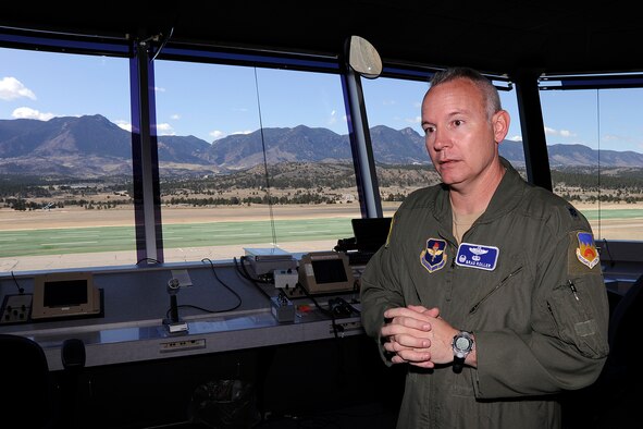 Lt. Col Brad Roller explains the benefits of the new sailplane landing area from the control tower at the Air Force Academy March 20, 2012. Roller commands the 94th Flying Training Squadron, an Air Education and Training Command tenant unit here. (U.S. Air Force photo/Mike Kaplan)