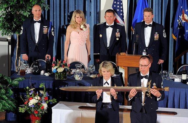 Chief Master Sgts. Carolyn Henriques of the 10th Force Support Squadron and Randall Doersch of the Air Force Academy Band, perform their duties as Keepers of the Sword during an Order of the Sword ceremony for Academy Superintendent Lt. Gen. Mike Gould March 19, 2012. Gould is the 234th inductee into the Order of the Sword. (U.S. Air Force photo/Raymond McCoy)