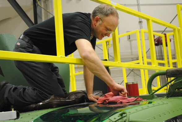 Mark Osentowski, 341st Maintenance Operations Squadron aircraft mechanic, performs maintenance on a UH-1N Huey during the third week of an inspection. Malmstrom's helicopter maintainers are constantly performing inspections to ensure aircraft is airworthy. (U.S. Air Force photo/Airman 1st Class Katrina Heikkinen)