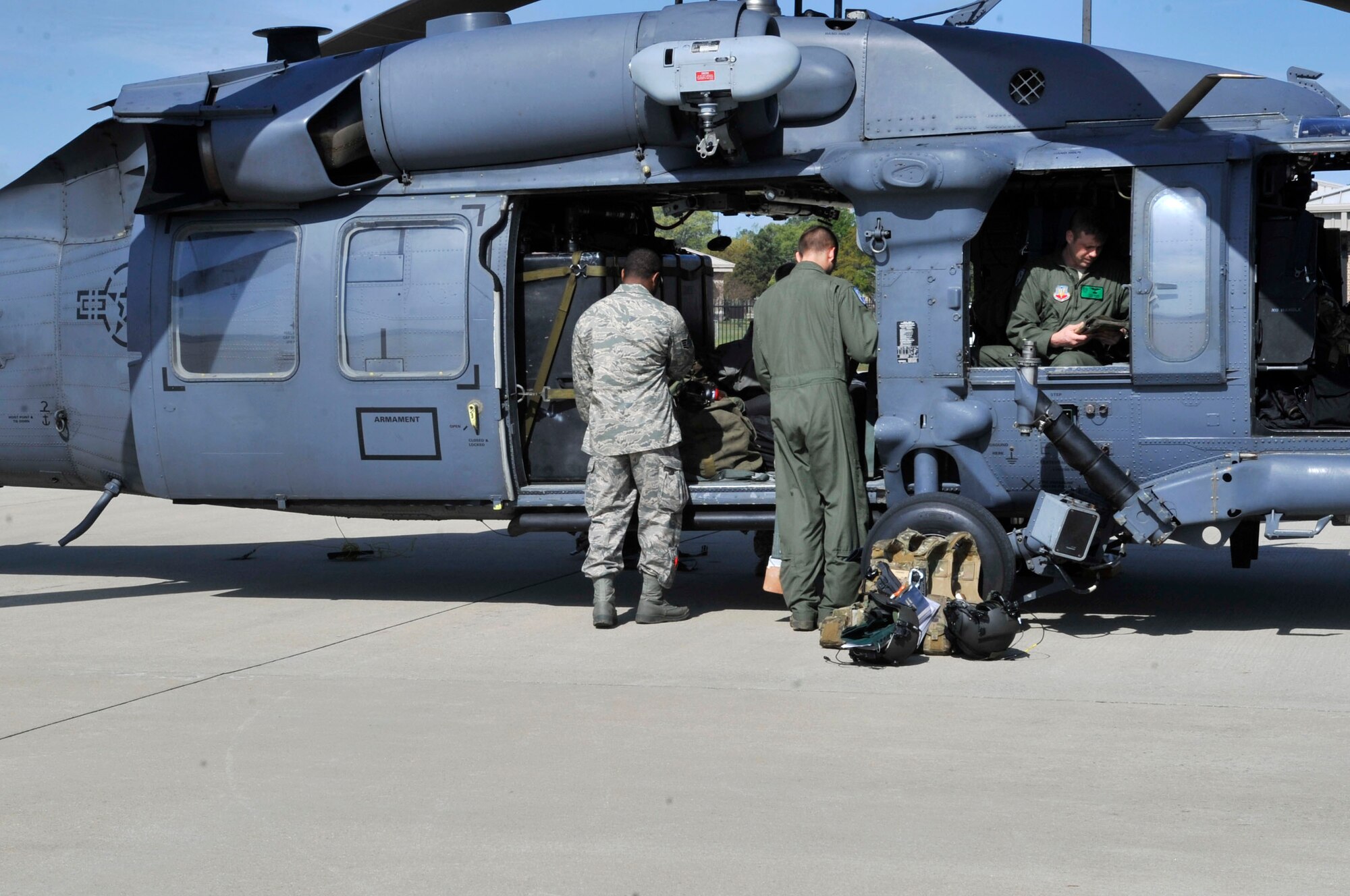 U.S. Air Force Airmen prepare an HH-60 Pave Hawk for flight at Shaw Air Force Base, S.C., March 22, 2012. These Airmen were preparing for a flight to Moody Air Force Base with Col. Billy Thompson, 23rd Wing Commander. (U.S. Air Force photo by Airman Nicole Sikorski/Released)