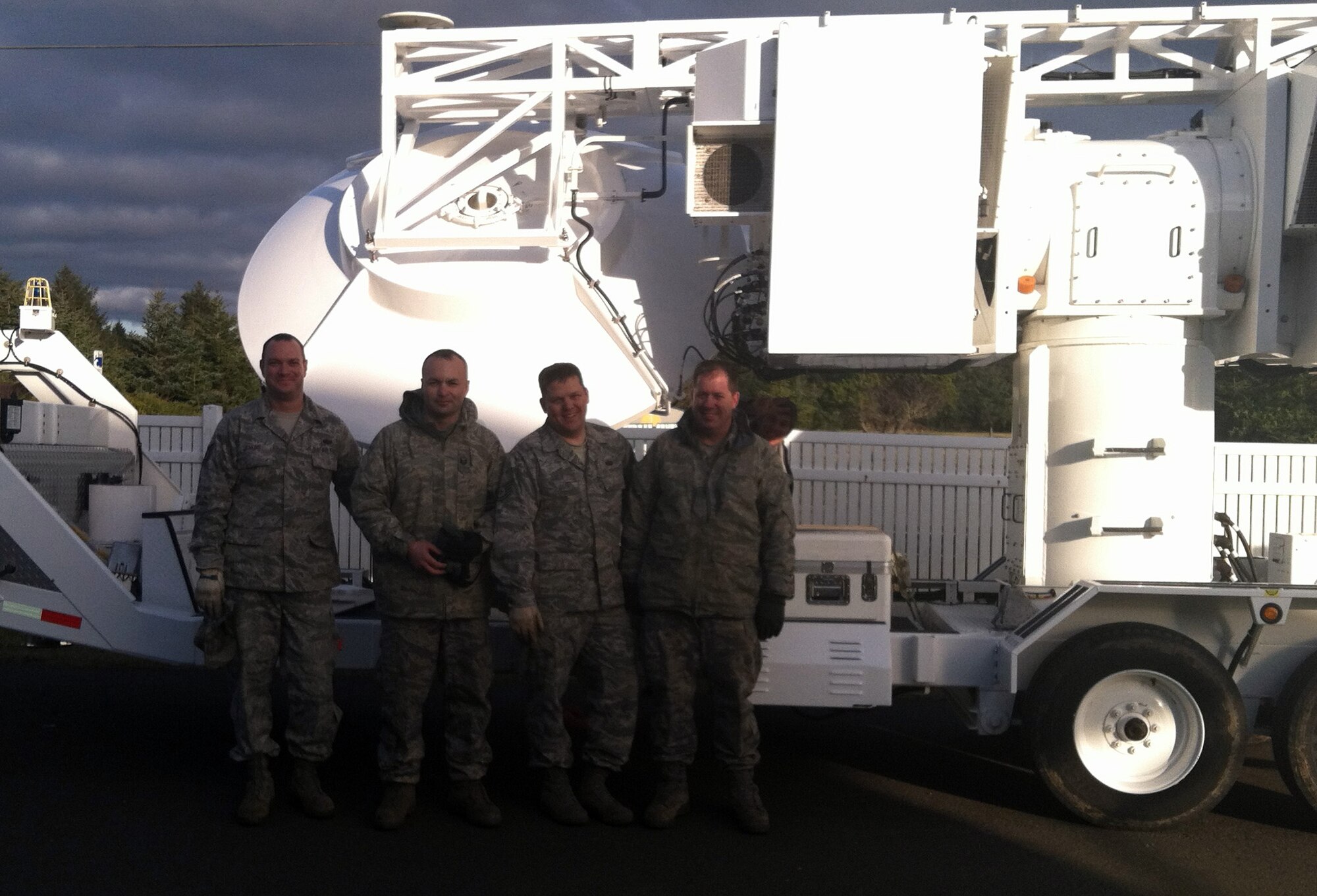 Members of the 266th Range Squadron pose in front of the Joint Threat Emitter Unit Feb. 16, 2012, at Pacific Beach, Wash. The 266th RANS personnel stationed at Mountain Home Air Force Base, Idaho, operate surface-to-air missile simulators helping test aircrew’s ability to recognize a threat then identify and react correctly according to the specific situation presented. (Courtesy photo)