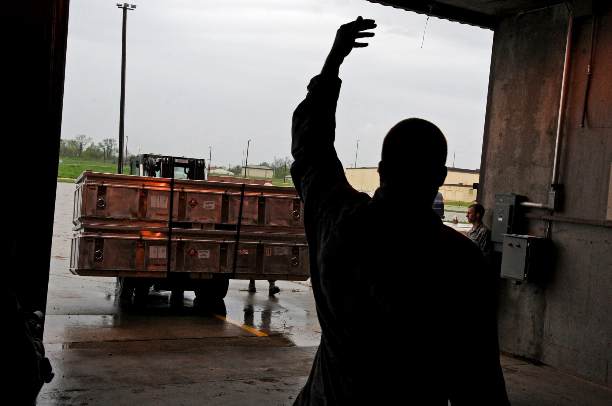 Senior Airmen Jacob Coltson, 2nd Munitions Squadron, directs a fork lift carrying unloaded Miniature Air Launch Decoys into a munitions storage area on Barksdale Air Force Base, La., March 21. MALDs are small jet powered decoys used to throw off enemy integrated air defense systems. Currently the B-52H Stratofortress and the F-16 Fighting Falcon are the only aircraft capable of carrying MALDs. (U.S. Air Force photo/Airman 1st Class Micaiah Anthony)(RELEASED) 

