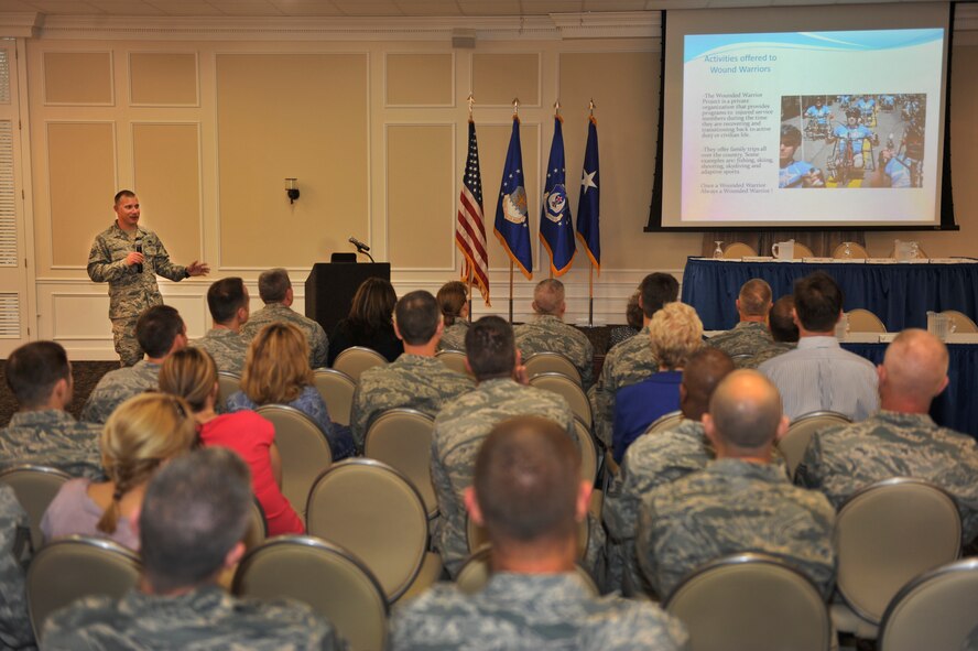 Staff Sgt. Benjamin Seekell talks to 9th Air Force Outstanding Professional of the Year program attendees about his experience as a Wounded Warrior at the Carolina Skies Club, Shaw Air Force Base, S.C. March 21, 2012. The Wounded Warrior program helps service members who have combat or hostile-related injuries or illnesses receive professional support and care from the point of injury, through separation or retirement, for life. Sergeant Seekell, a military working dog handler for the 4th Fighter Wing Security Forces Squadron, Seymour Johnson Air Force Base, N.C., lost the lower part of his left leg while serving in Afghanistan in 2011. (U.S. Air Force photo by Senior Airman Neil D. Warner/Released)
