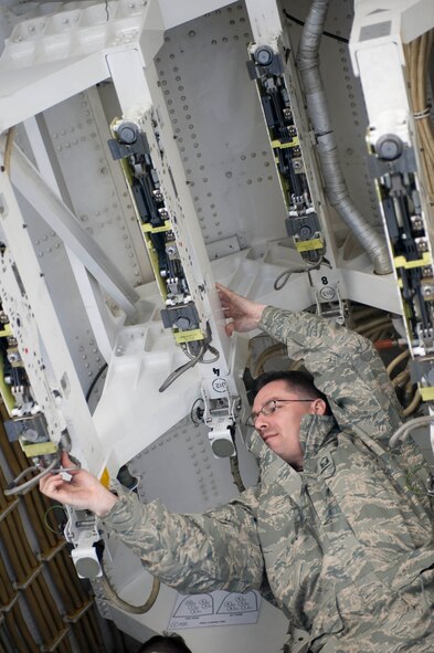 Master Sgt. Robert Cortez, 34th Aircraft Maintenance Unit assistant flight chief, performs an inspection of a B-1 bomber bomb bay during the Phase I Operational Readiness Exercise at Ellsworth Air Force Base, S.D., March 14, 2012.  The pre-flight inspection ensures the aircraft is combat ready.  (U.S. Air Force photo by Airman 1st Class Anania Tekurio/Released) 