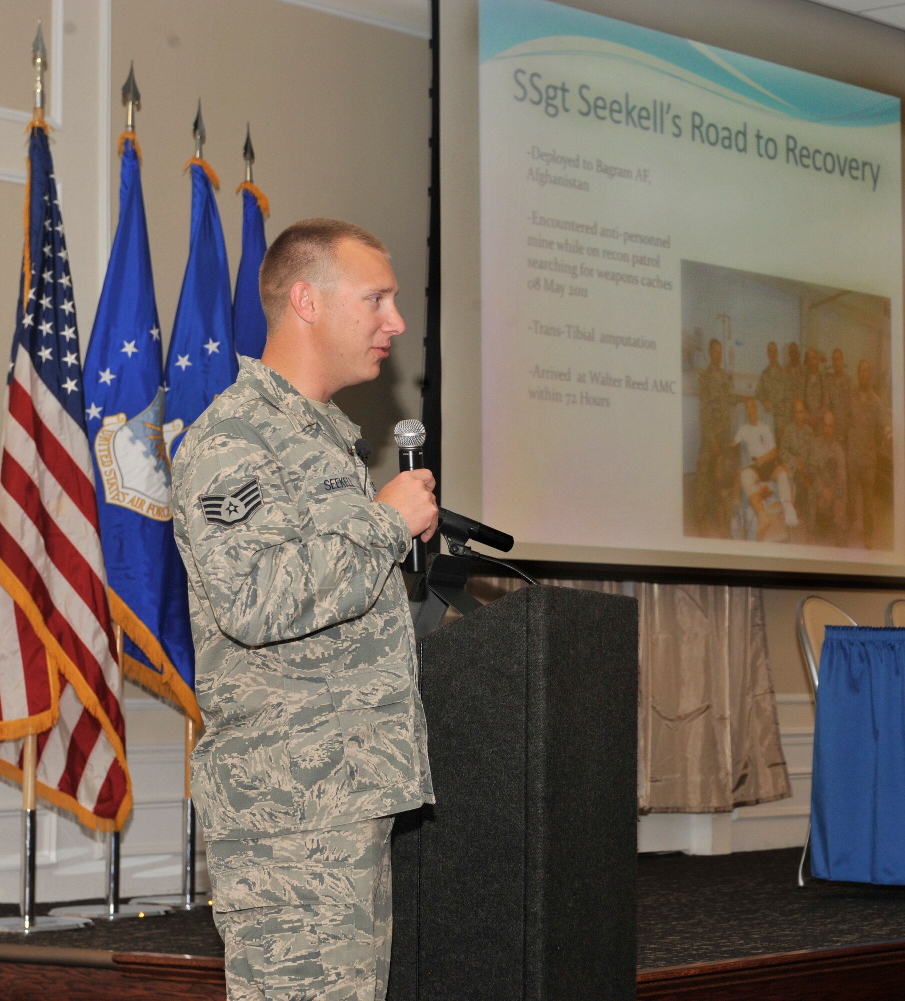 Staff Sgt. Benjamin Seekell talks to 9th Air Force Outstanding Professional of the Year program attendees about his experience as a Wounded Warrior at the Carolina Skies Club, Shaw Air Force Base, S.C. March 21, 2012. The Wounded Warrior program helps service members who have combat or hostile-related injuries or illnesses receive professional support and care from the point of injury, through separation or retirement, for life. Sergeant Seekell, a military working dog handler for the 4th Fighter Wing Security Forces Squadron, Seymour Johnson Air Force Base, N.C., lost the lower part of his left leg while serving in Afghanistan in 2011. (U.S. Air Force photo by Senior Airman Neil D. Warner/Released)