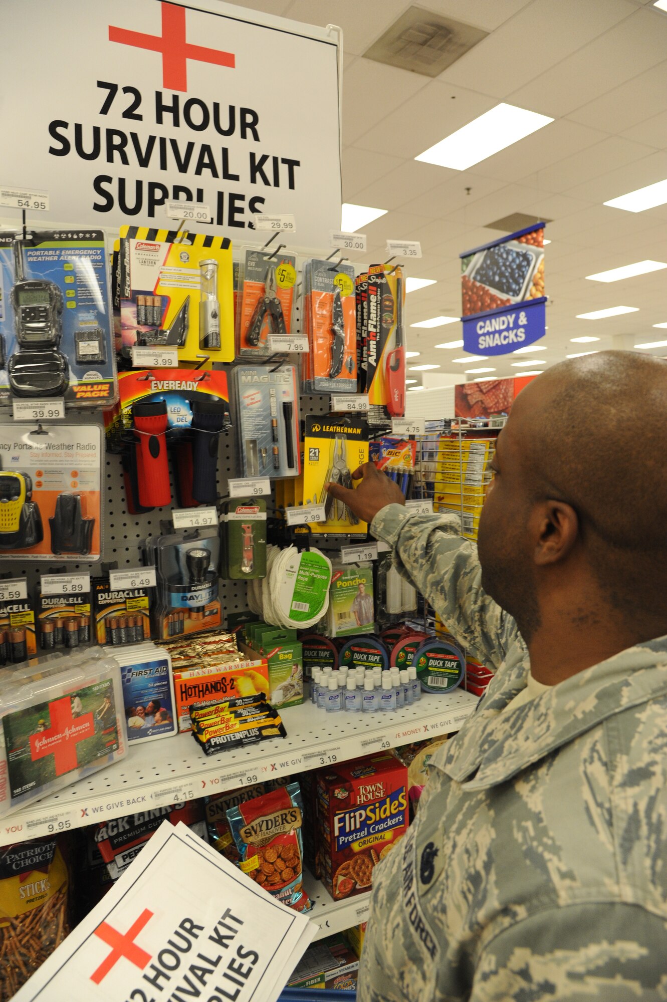 Staff Sgt. Steven Reed, 435th Supply Chain Operations Squadron stock control grounds technician, purchases items for a 72-hour kit for his place of residence. All Team Scott members are encouraged to prepare an emergency kit in case the need arises. The Army and Air Force Exchange Service has a designated area and a list provided for your convenience (U.S. Air Force photo/ Senior Airman Tristin English)