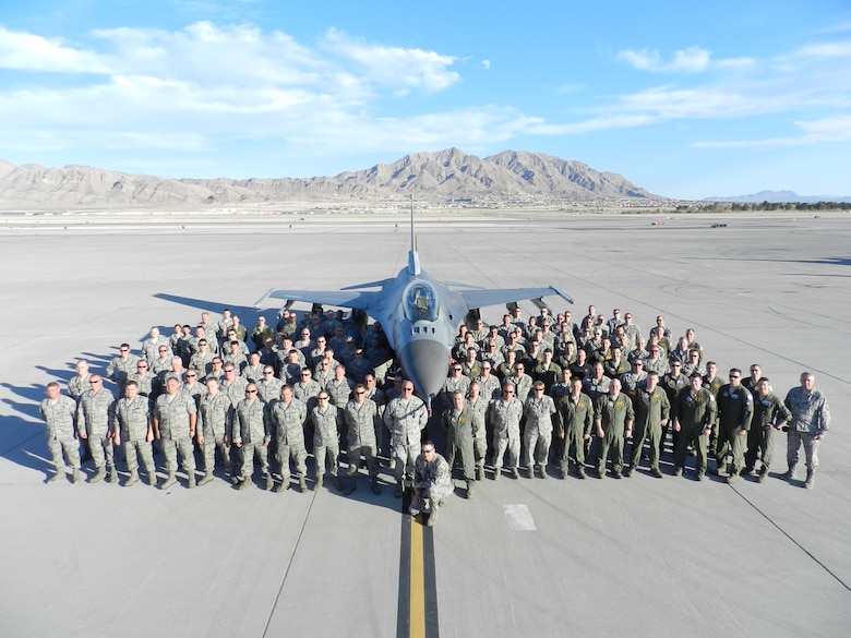More than 150 148th Fighter Wing members pose with a Block 50 F-16 Mar. 15, 2012 at Nellis Air Force Base, Nevada.  The 148th participated in Red Flag, a final exercise at the tail end of the 148th’s conversion to the Block 50 F-16 from Feb. 27 to Mar. 16. (Courtesy photo.)
