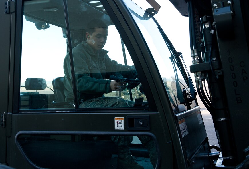 Airman 1st Class Matthew Sinnemaki, 28th Logistics Readiness Squadron vehicle operations apprentice, operates a forklift to move cargo destined for the new deployment processing center on Ellsworth Air Force Base, S.D., March 21, 2012. The upgraded deployment center will be used to prepare and process personnel and cargo during exercises and contingencies. (U.S. Air Force photo by Airman 1st Class Kate Thornton/Released)
