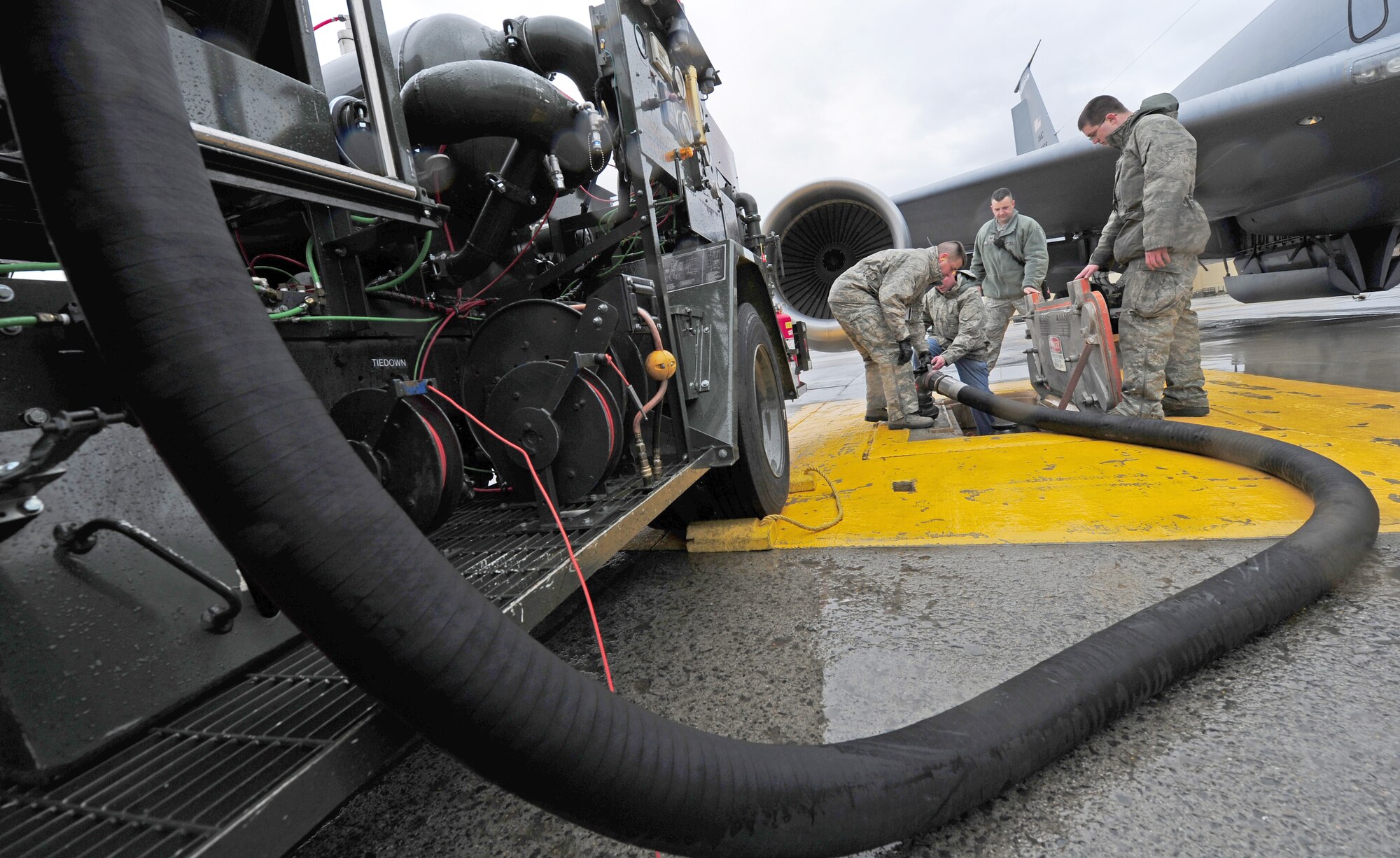 Col. Mike Hill, 92nd Mission Support Group commander, removes the fuel hose after completing the refueling of a KC-135 Stratotanker on the flightline at Fairchild Air Force Base, Wash., March 15, 2012. Hill is participating in this operation to better understand the effort put into the mission from his enlisted Airmen. (U.S. Air Force photo by Airman 1st Class Taylor Curry/Released)