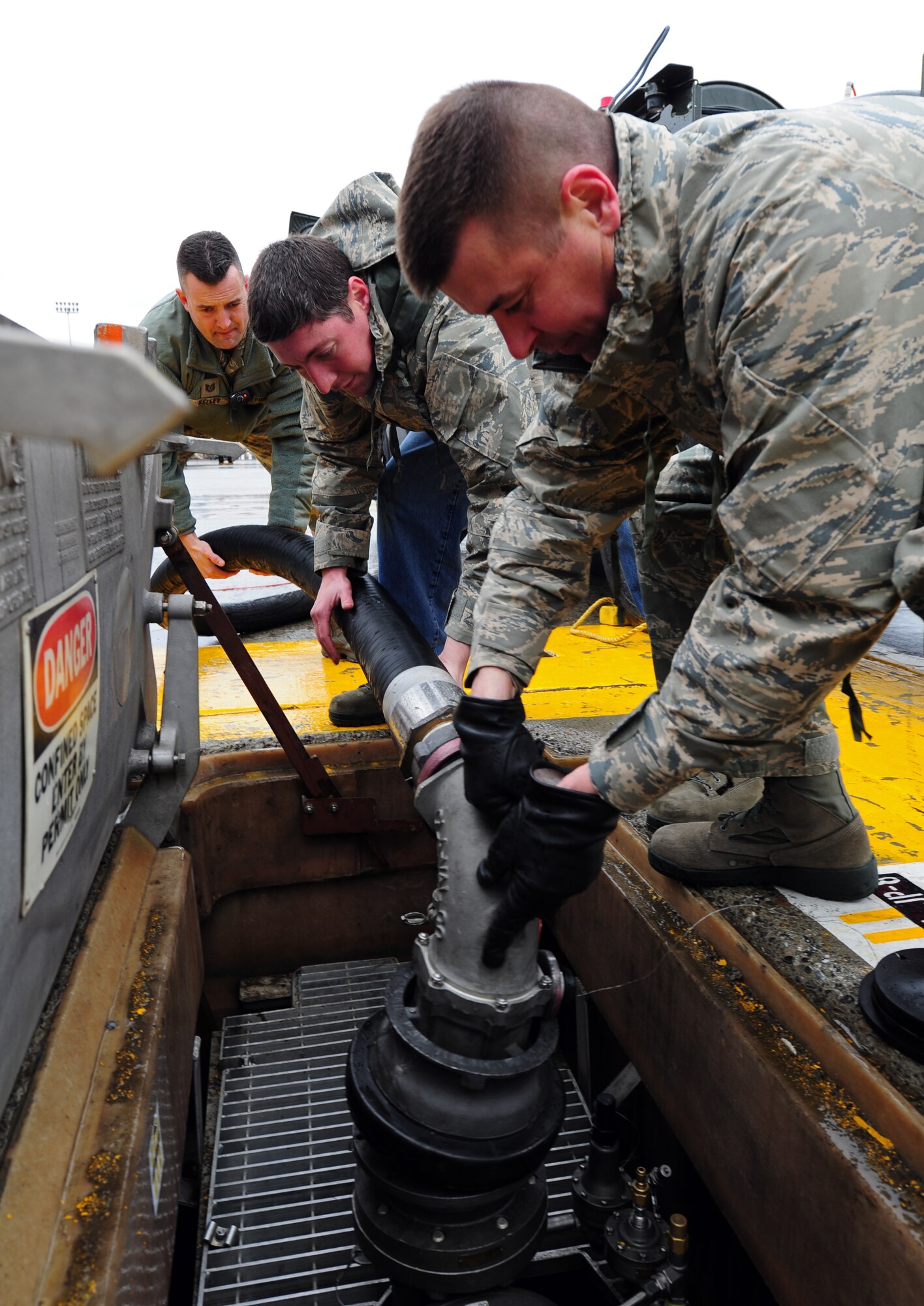 Col. Mike Hill, 92nd Mission Support Group commander, attaches a fuel hose from a hydrant serving vehicle to a fuel tank during an aircraft refueling operation on the flightline at Fairchild Air Force Base, Wash., March 15, 2012. Hill is participating in this operation to better understand the effort put into the mission from his enlisted Airmen. (U.S. Air Force photo by Airman 1st Class Taylor Curry/Released)